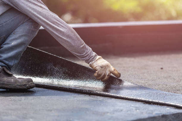 Professional Basement Waterproofing technician working in Riverdale, MI